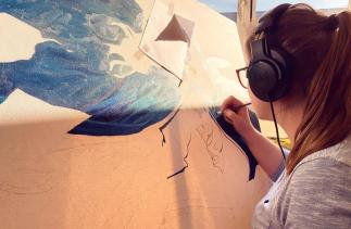 Agnieszka working in her studio on a canvas