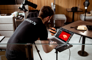 Picture of Dariusz working on a shoot in a cafe photographing food