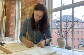 Katherine Brookes sewing in her studio